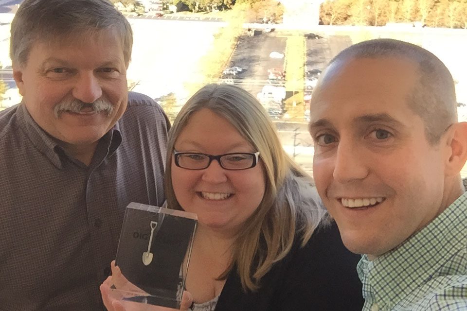 Comer leaders holding the Miss Utility Smart Dig Award in 2019