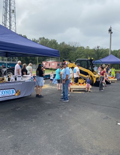 Attendees enjoying the Comer Construction display