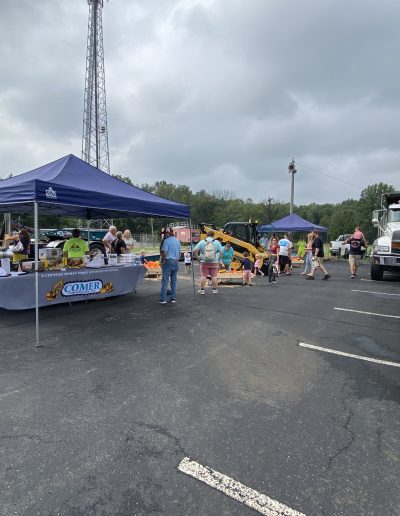 Attendees enjoying the Comer Construction display