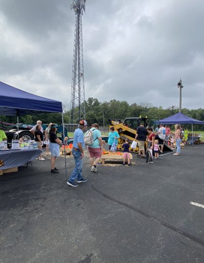 Attendees enjoying the Comer Construction display