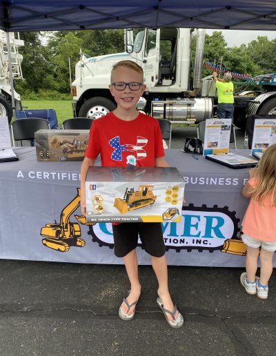 A boy poses with his toy prize