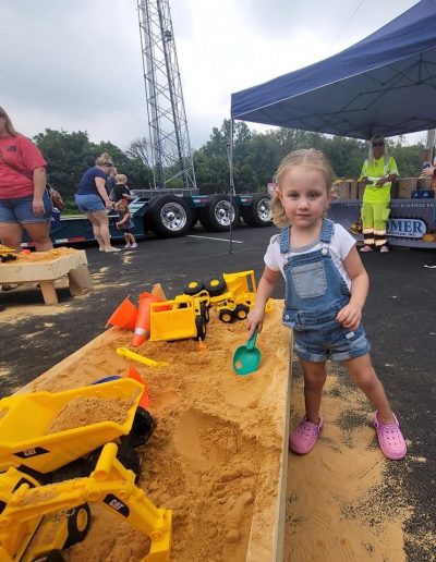 Children play with toys on sandbox
