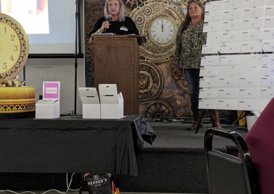 Linda Sue "Susie" Comer, the president & treasurer of Comer Construction speaks at the 2021 Employee Appreciation Event