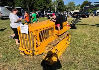 Mother with son in National Night Out display by Comer Construction.