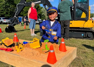 A child enjoys a sandbox at National Night Out